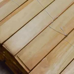 Packs of natural sliced pine veneer tied for transportation