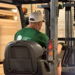 WoodWay Expert forklift moving veneer pallets in the warehouse
