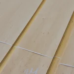 Texture and grain pattern of natural sliced alder veneer close-up