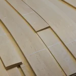 Laid out sheets of sliced alder veneer of various lengths on a pallet
