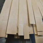 Laid out bundles of sliced alder veneer ranging from 0.8 to 2.05 meters in length.