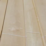 Texture of natural sliced alder veneer 2.5 mm grade 2 with a delicate wood grain pattern.