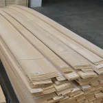 Long packs of sliced alder veneer 2.1-3.8 m in the lumber warehouse.