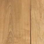 Wood grain texture of natural sliced American cherry veneer.
