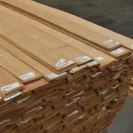 Bundles of sliced American cherry veneer with barcode labels.