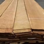 Edge view showing the 0.6 mm thickness of sliced American cherry veneer sheets.