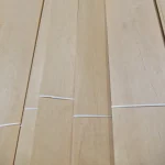 Light wood texture of alder on sliced veneer of the second grade
