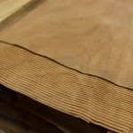 Edges of sliced American cherry veneer sheets showing 0.6 mm thickness