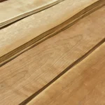 Detailed view of the surface and fibers of sliced American cherry veneer