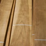 Bundle of sliced American cherry veneer secured with a strap