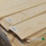 Packs of natural sliced white ash veneer 0.6 mm thick in the warehouse
