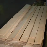Bundles of first grade sliced white ash veneer laid out on a table