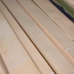 Detailed view of the surface and growth rings of sliced white ash veneer