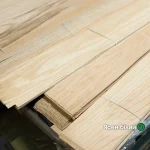 Bundles of natural sliced white ash veneer 0.6 mm thick in the warehouse