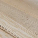 Texture and grain pattern of natural sliced white ash wood veneer