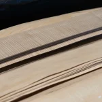 Detailed view of fibers and structure of sliced white ash veneer