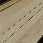 Laid out sheets of first grade sliced white ash veneer 2.1-3.8 m long.