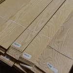 Bundles of natural sliced white ash veneer 1.5 mm tied for transportation.