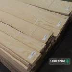 Packs of natural sliced white ash veneer 2.5 mm thick in the warehouse.