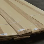 Packs of sliced olive ash veneer 1.5 mm stacked on a pallet