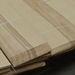 Stacked ends of natural sliced ash veneer packs