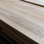 Detailed view of the wood grain and texture of sliced olive ash veneer 0.6 mm.