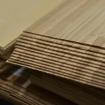 Close-up of sheet edges showing 1.5 mm thickness of olive ash veneer