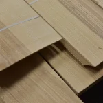 Overlapping sheets of natural sliced olive ash veneer