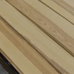 Laid out sheets of sliced olive ash veneer at an angle
