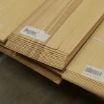 Packs of sliced olive ash veneer with barcode labels