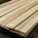 Warehouse pallet with bundles of 1st grade sliced olive ash veneer