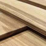 Cut of a sliced olive ash veneer bundle demonstrating sheet thickness