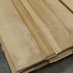 Stacked packs of Sliced Olive Ash Veneer 2.5 mm on a pallet.