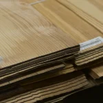 Edge view of Sliced Olive Ash Veneer sheets showing 2.5 mm thickness.