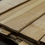 Stack of Sliced Olive Ash Veneer 2.5 mm packs on a pallet.