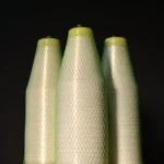 Three vertical spools of Kuper 1110 glue thread in protective mesh