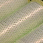 Close-up of Kuper 1110 glue thread winding texture under protective mesh
