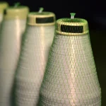 Row of Kuper 1110 glue thread spools in a veneer materials warehouse