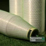 Kuper 1220 glue thread for veneer splicing in green protective mesh on a branded background.