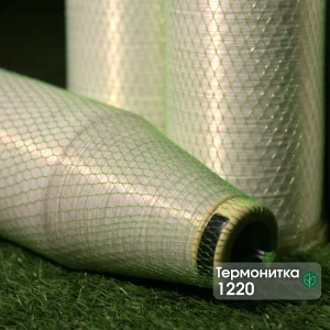 Термонитка Kuper 1220 для зшивання шпону в захисній зеленій сітці на фірмовому тлі.