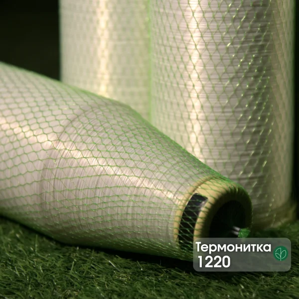 Kuper 1220 glue thread for veneer splicing in green protective mesh on a branded background.