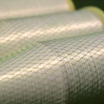 Close-up texture of Kuper 1220 glue thread winding under protective mesh.