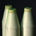 Upper part of three Kuper 1220 glue thread spools for veneer splicing.