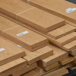 Stacked bundles of Amur Cork Tree sawn veneer 4.5 mm thick in warehouse