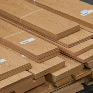 Stacked bundles of Amur Cork Tree sawn veneer 4.5 mm thick in warehouse