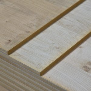 Corner close-up of an oak wall panel, showing the grooved seam and rough-sawn edge with knots.